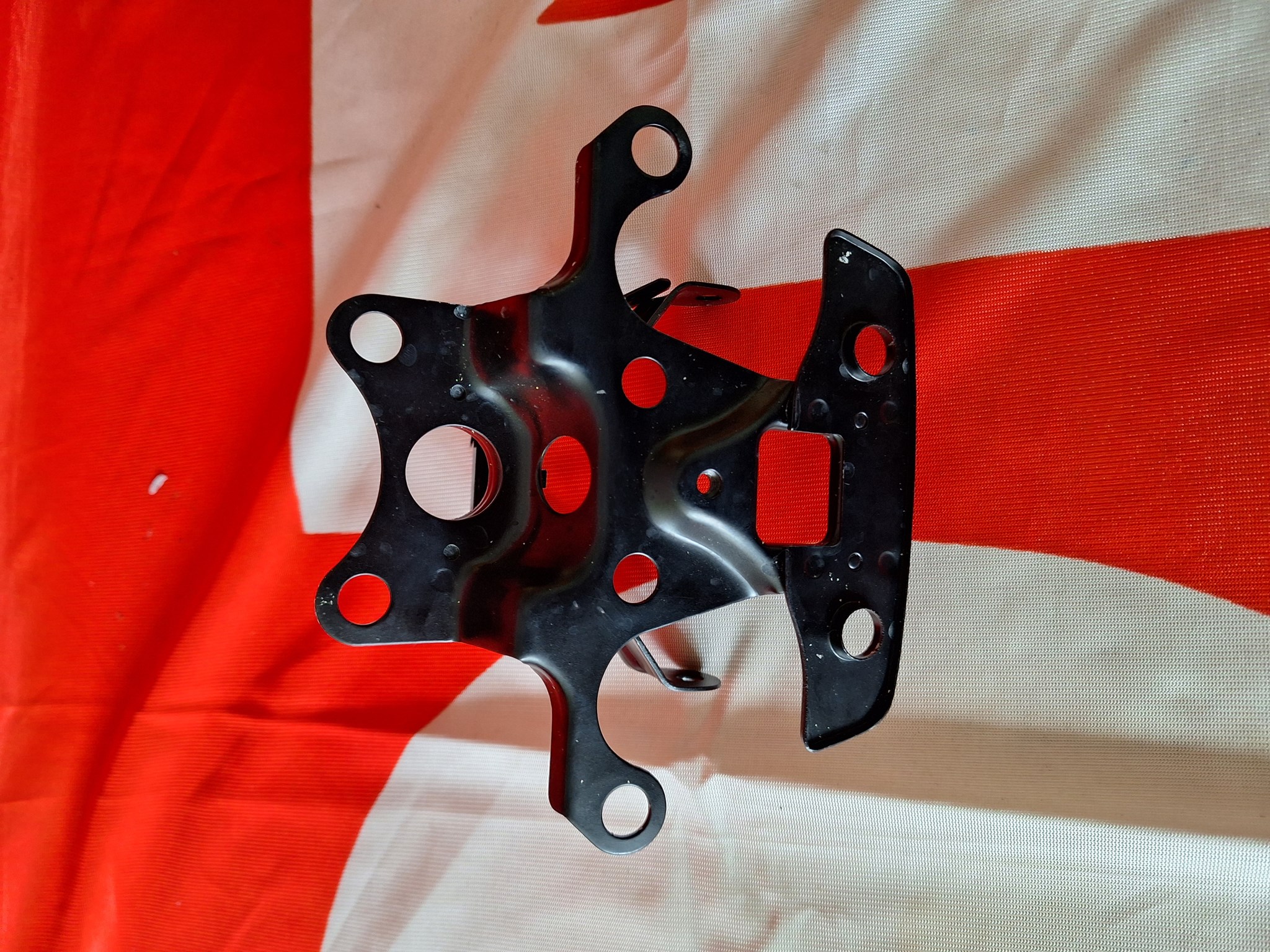 Picture of BRKT,H/L,*NH-105*  61310-428-830ZA